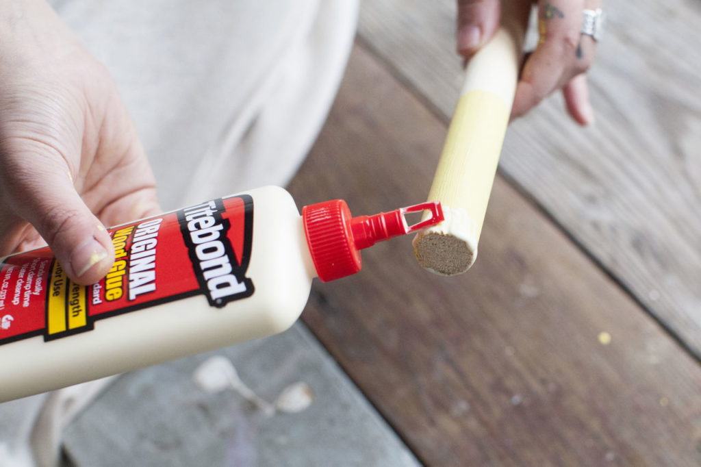 Step 3: Apply a thin layer of wood glue to one end of your 12-inch dowels.
