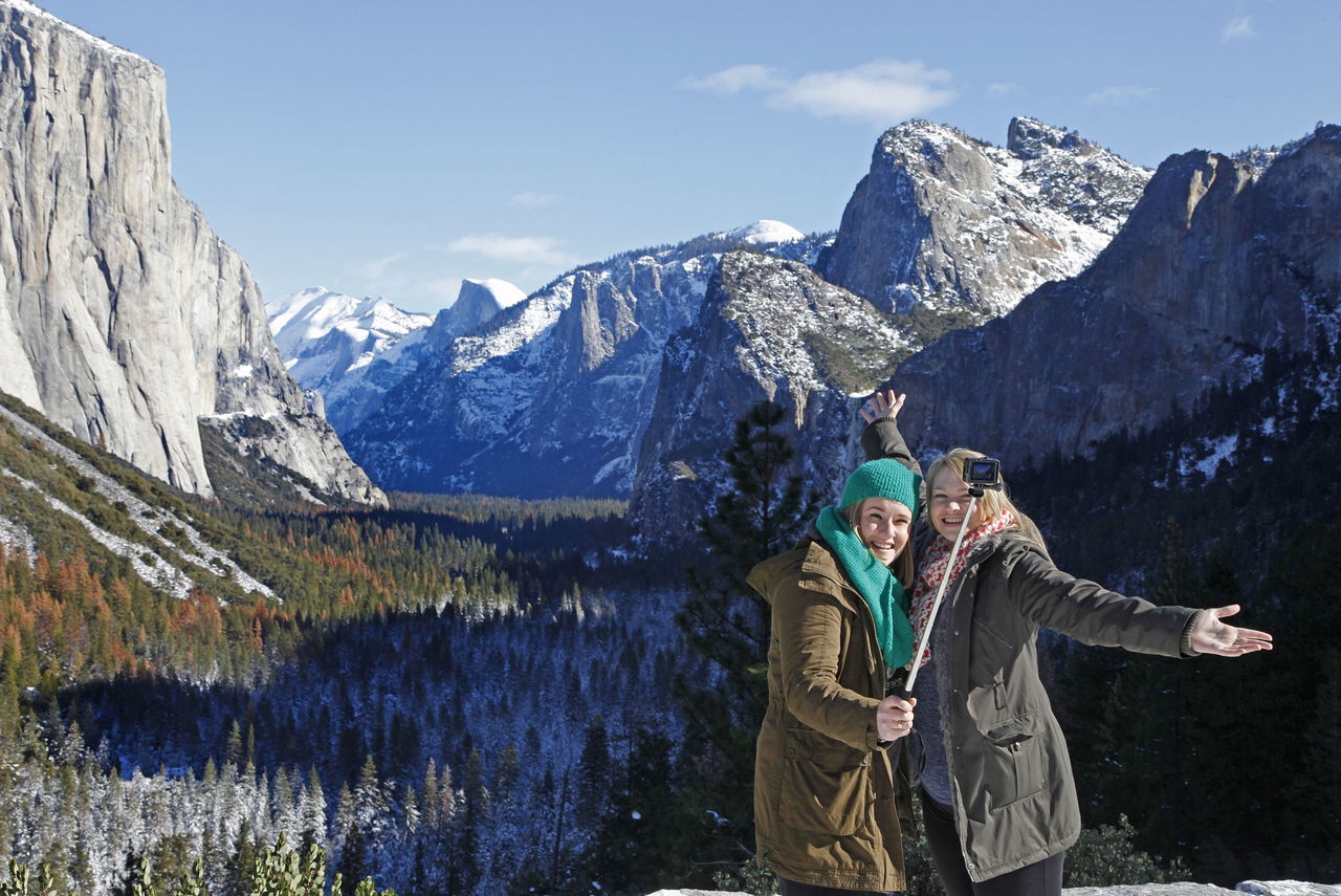 Sarah Selwood (left) and Ashley Wilson from Australia take a selfie at Tunnel View in Yosemite National Park, California.