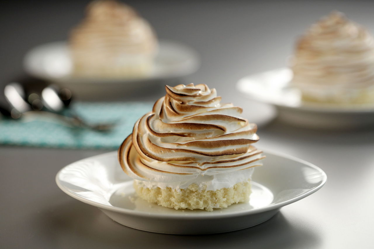 Sizing baked Alaska as individual servings updates the retro dessert. Using purchased pound cake and ice cream means fast assembly.