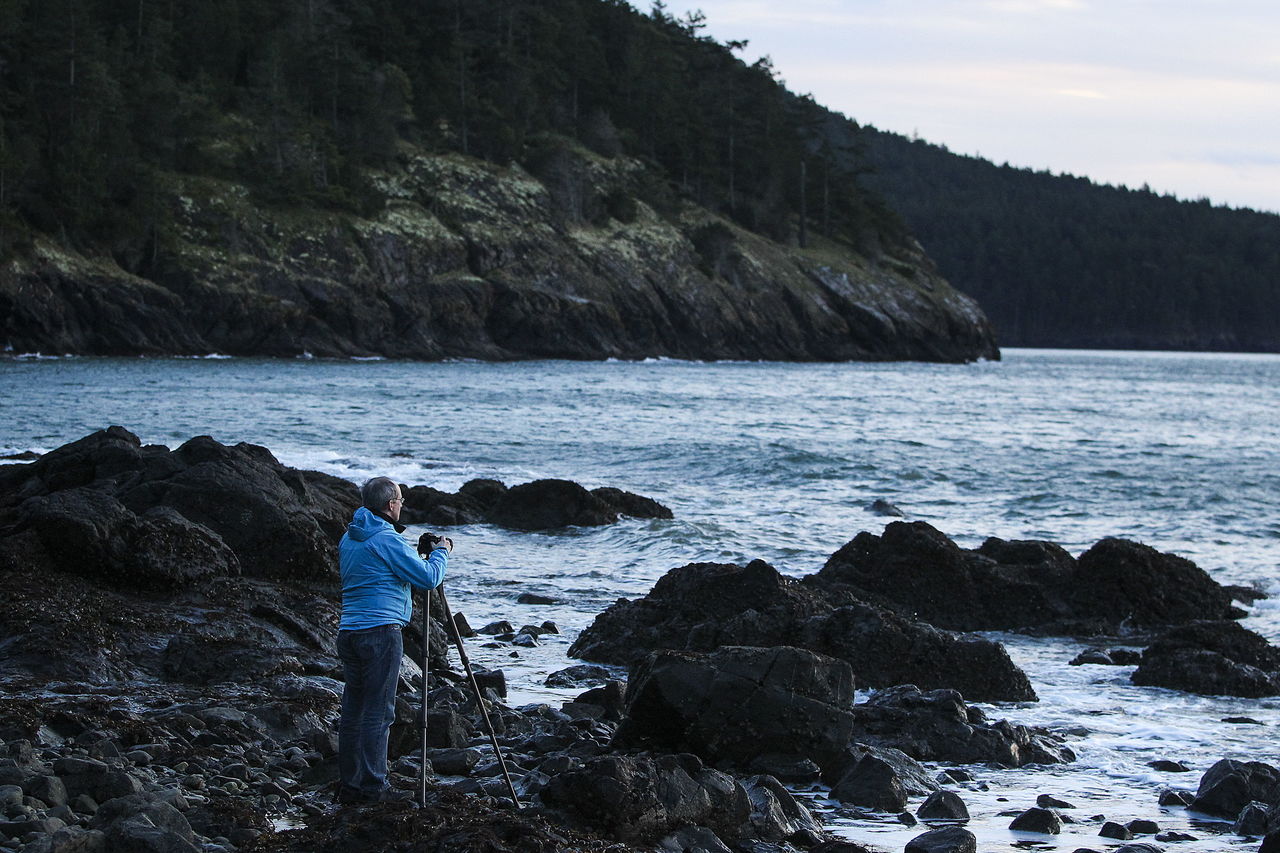 A photographer catches the last glimpses of evening light at Washington Park in Anacortes on Feb. 18. The 220-acre park offers a public boat launch, areas for hiking and biking as well as scenic beaches.