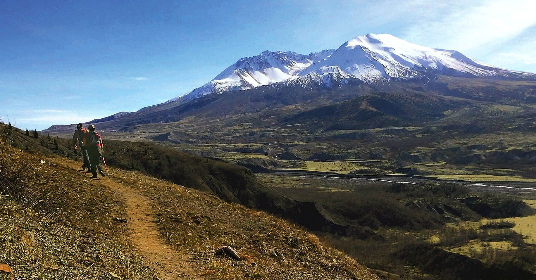 Tom Paulu / Longview Daily News Hikers take in the view of Mount St. Helens on the Boundary Trail. At this time of year, there’s usually much more snow in the area.