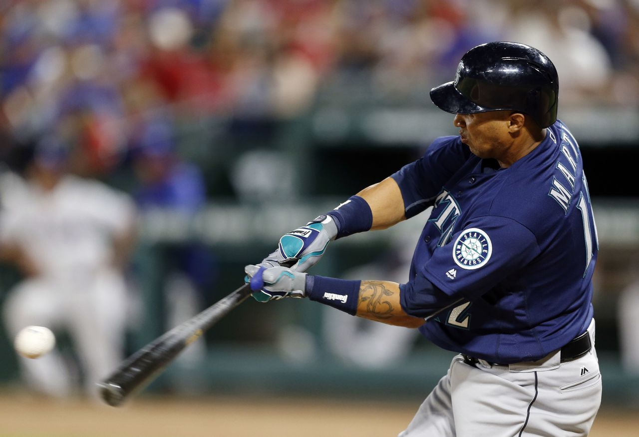 The Seattle Mariners’ Leonys Martin connects for a run-scoring double against the Texas Rangers. It’s the start of baseball season, which means it a good time to pick up one of these new books.