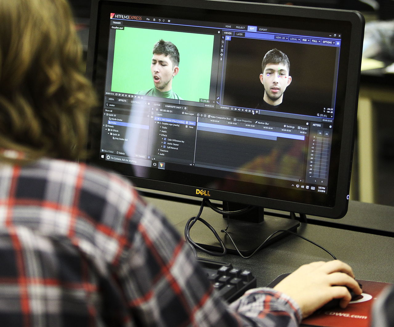 Sultan High School tech club member Alayna Posey works with video editing software to learn effects that can be achieved with the use of a green screen during a club meeting.
