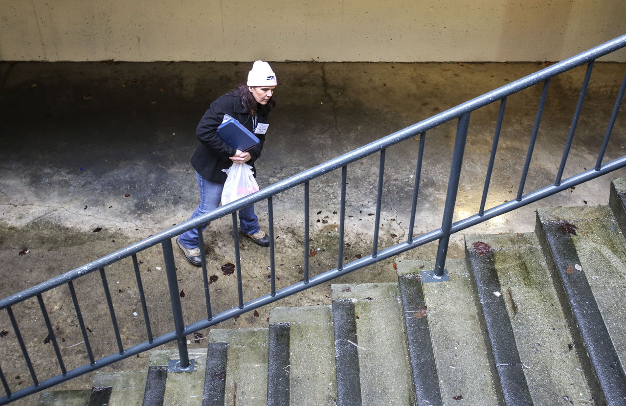 Volunteer Irene Slagle looks for homeless people during the annual Point in Time Count last Thursday in Everett.