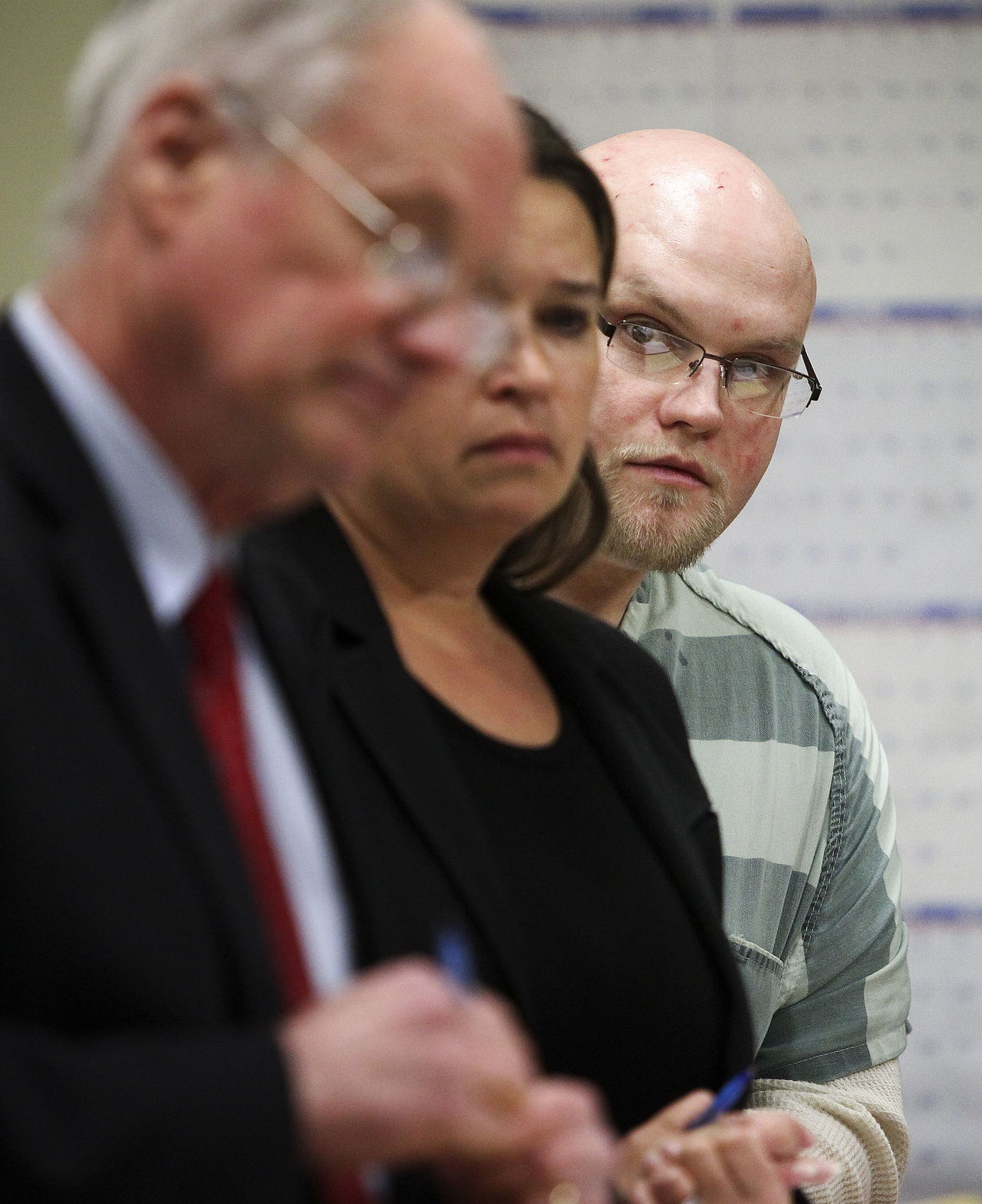 Daniel Rinker (right) waits in court during a sentencing hearing Monday, Feb. 1, 2016 at the Snohomish County Courthouse. Rinker was sentenced to 28 years in prison for the murder of Jessica Jones, a Tulalip woman, who was found shot to death in an Arlington garage on April 8, 2014.