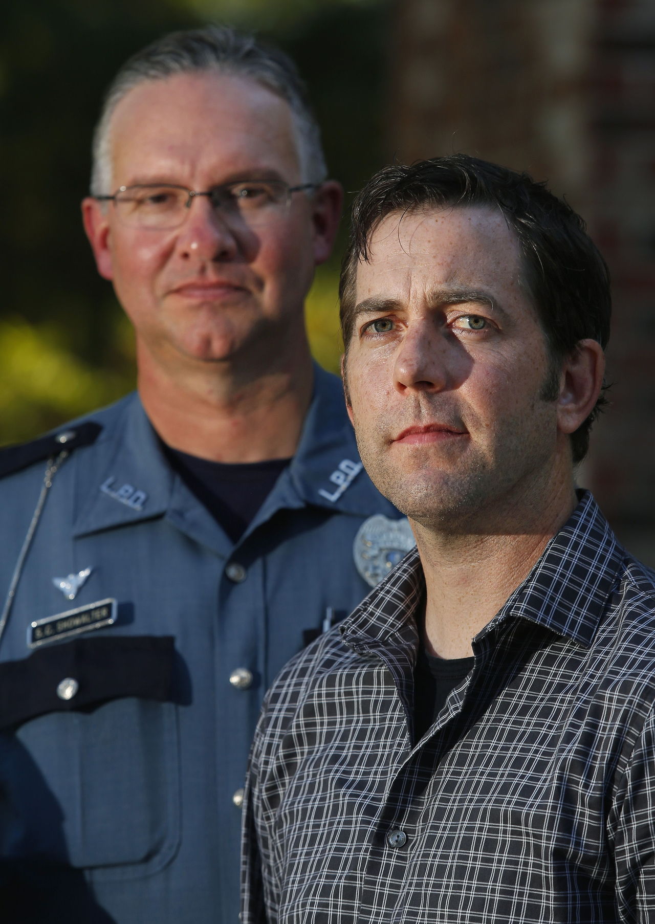 Lynnwood police officer Stephen Showalter (left) met Kevin Warner (right), after Warner was involved in a hit and run crash when a car hit his motorcycle just blocks from his home in Lynnwood.