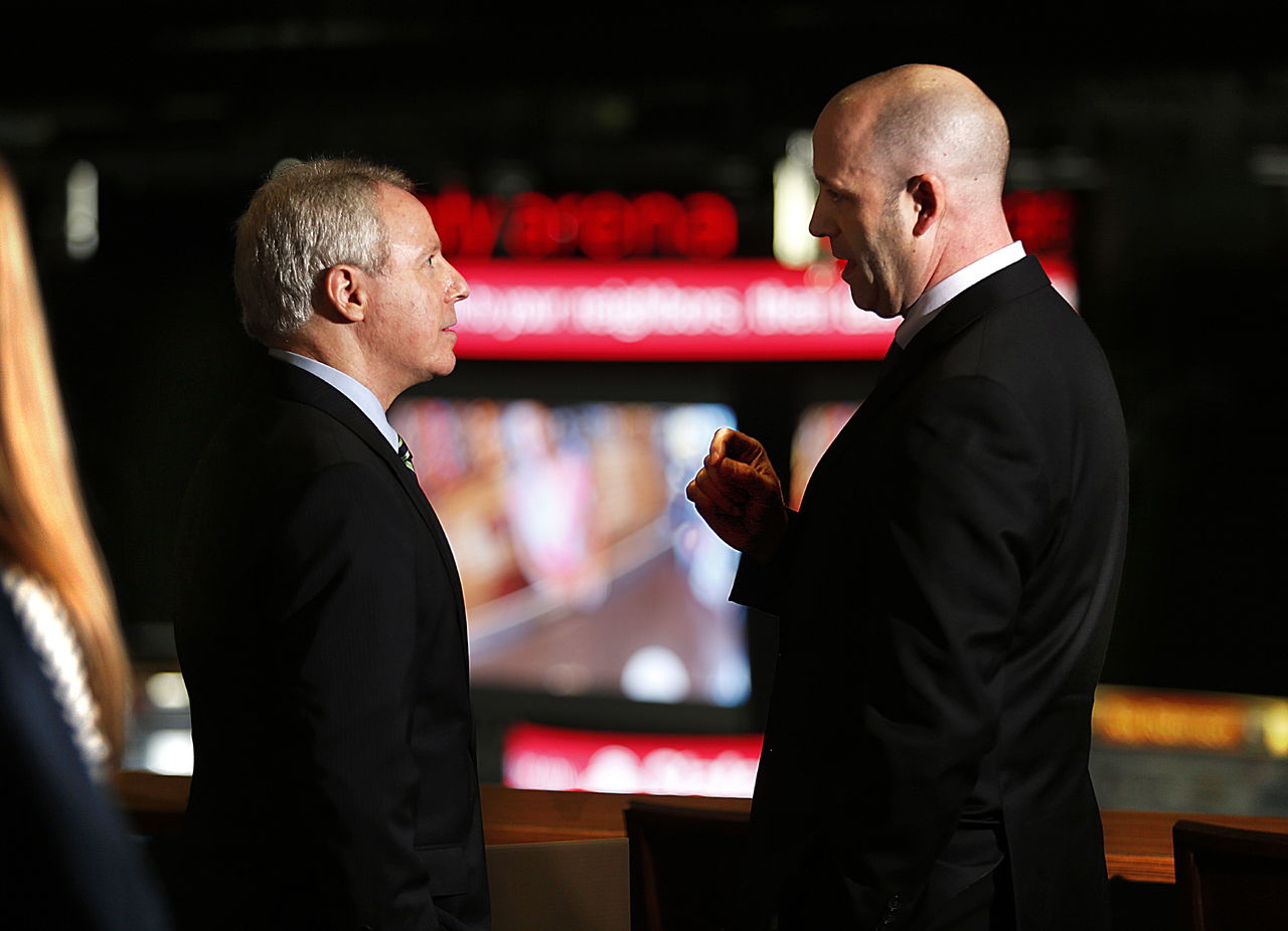 In the Octane Lounge, overlooking a new scoreboard at Xfinity Arena on Wednesday, Snohomish County Council Chairman Terry Ryan (left) talks with Rick Comeau, general manager of Xfinity Arena, after a brief ceremony during which officials gave the arena $250,000 toward the scoreboard.