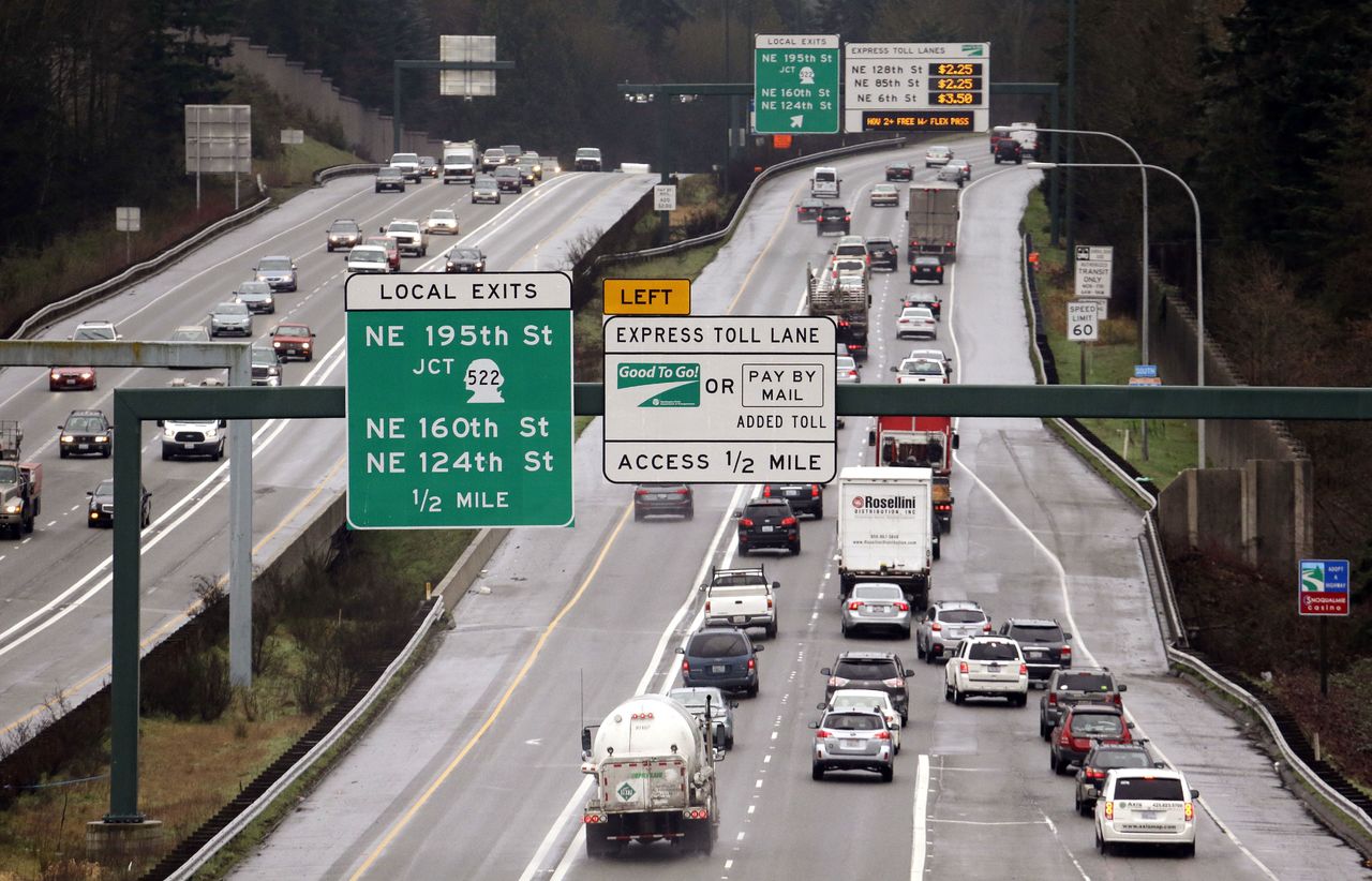 Toll-lane signs on southbound I-405 in Bothell.