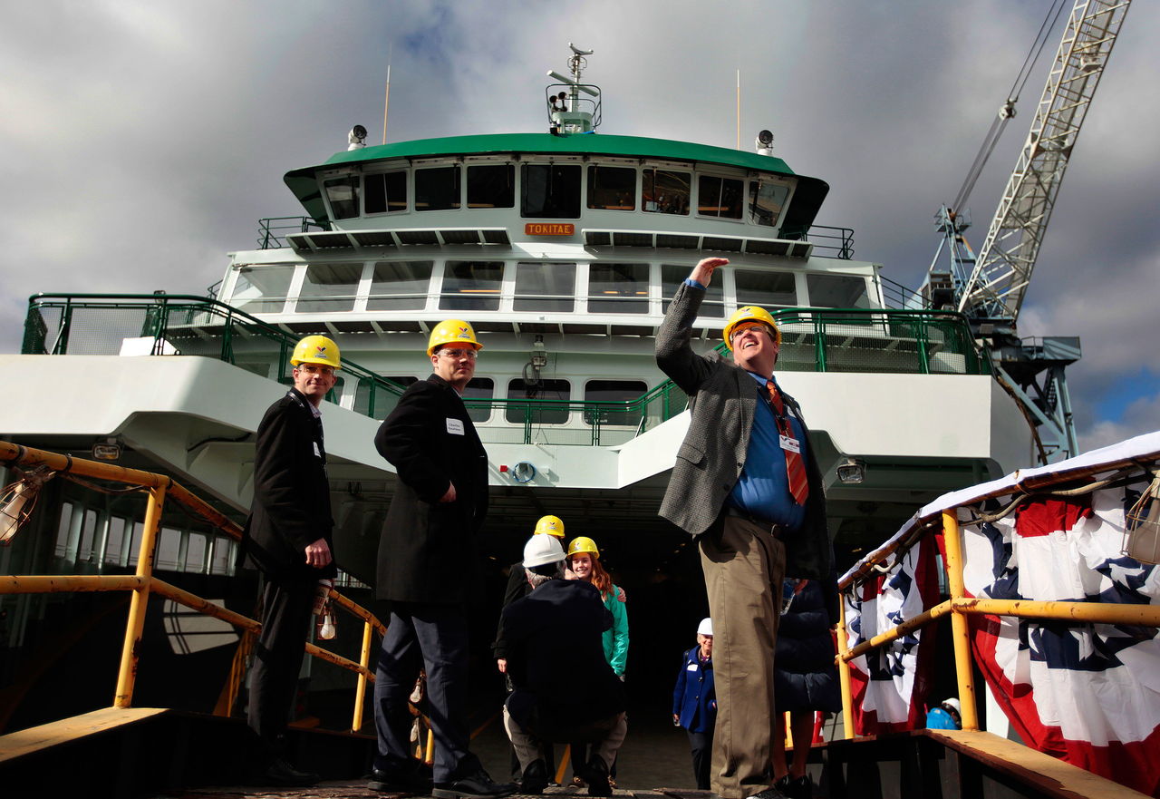 Visitors take a look at the ferry Tokitae after its christening in 2014 at the Vigor shipyard in Seattle. Money from the state will allow for the Tokitae to open the sun deck on weekends this summer.