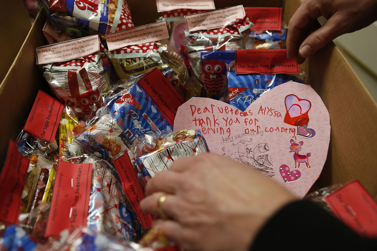 A box full of Valentine’s Day cards and bags of candy made by Camp Fire Girls of Snohomish County is seen at the Veterans Affairs Puget Sound Health Care System hospital in Seattle on Tuesday. Volunteers from the Everett Elks Lodge passed out the handmade cards to veterans at the hospital for the holiday.