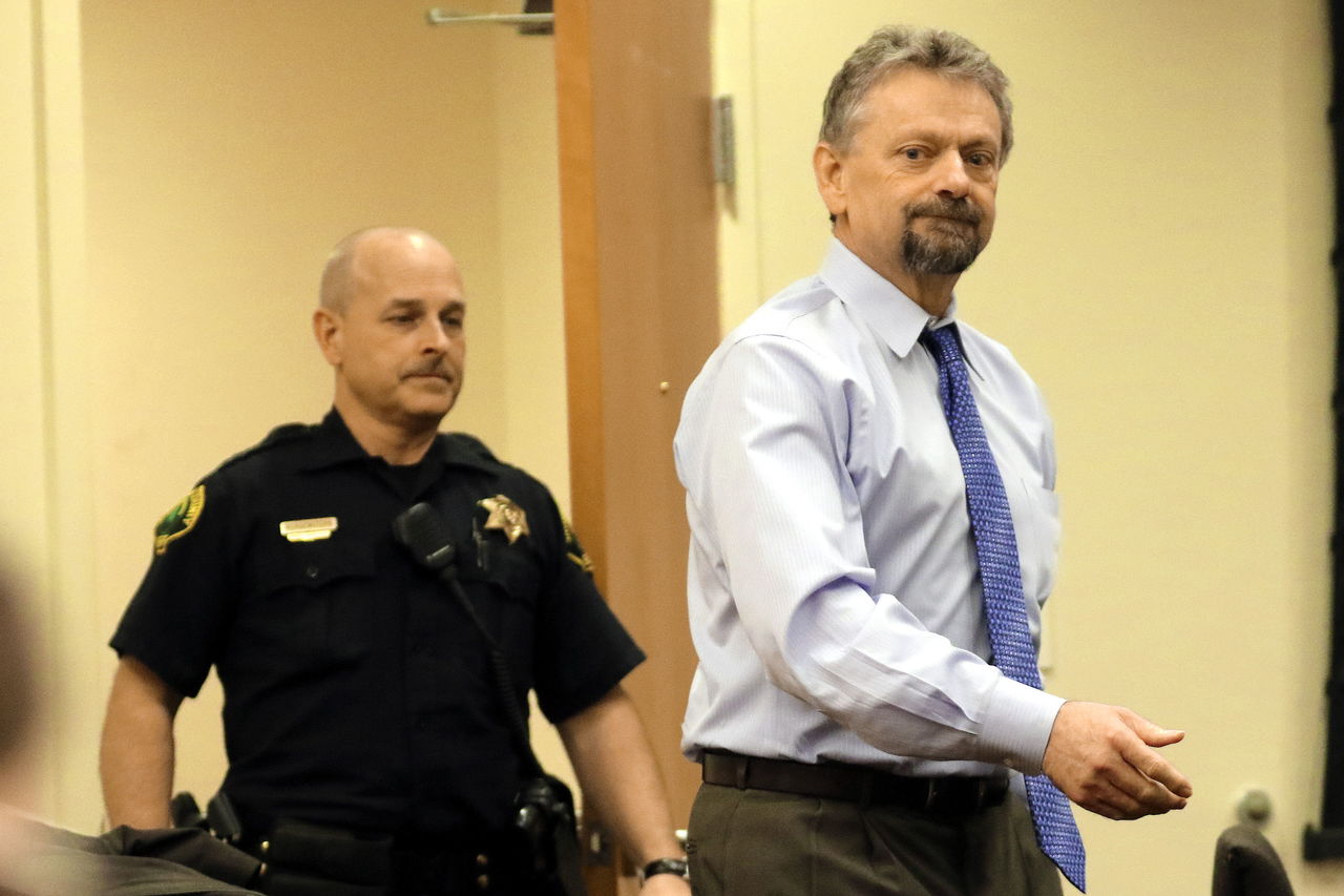 David Morgan is escorted to his seat during his first trial, in February, at the Snohomish County Courthouse in Everett.