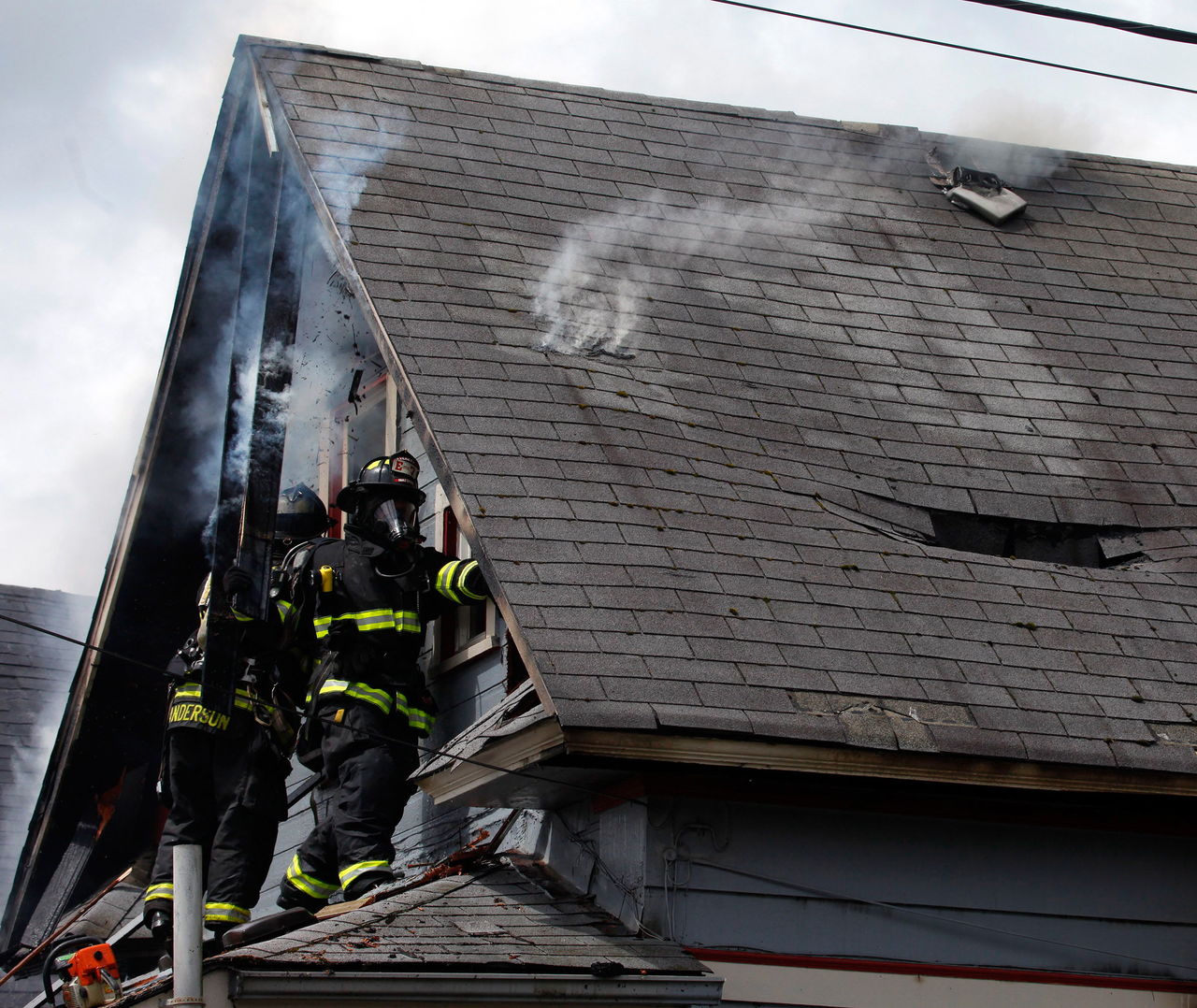 In May 2014, firefighters worked to extinguish a fire that consumed two houses near the corner of 23rd Street and Lombard Avenue in Everett, now the site for Habitat for Humanity’s Phoenix II project. Ground was broken Saturday for a new home that will be built there. The group’s goal is to help a family impacted by the Oso landslide.