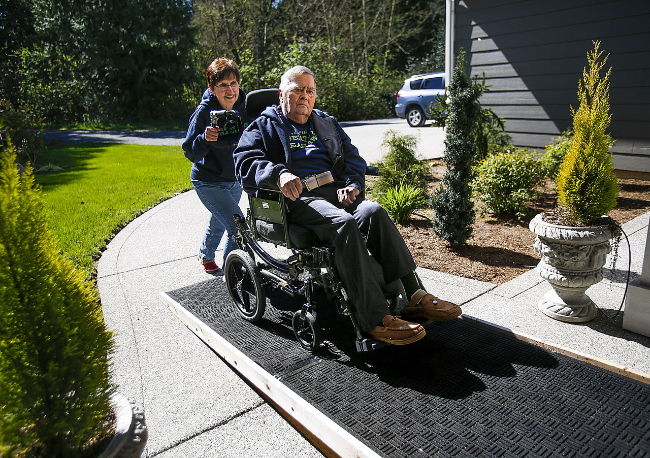 Ferrera takes Johnson up the ramp to the front door of their house after an outing.