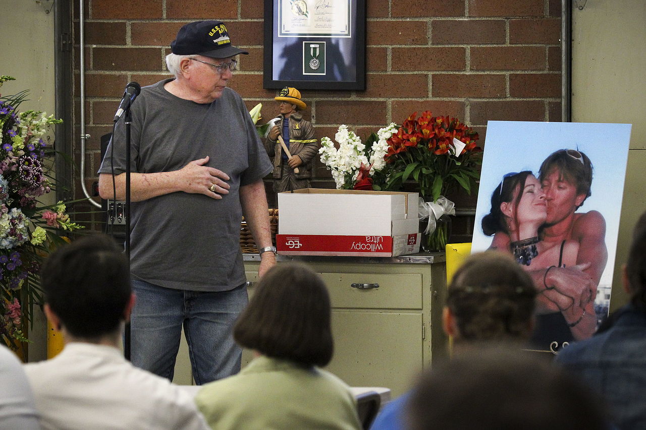 Mike Shunn pauses for a moment while sharing memories of his son, Patrick Shunn, and Patrick’s wife, Monique Patenaude (shown at right), during an event at the Oso Fire Station to remember the couple. The pair has been missing since April 11, and their neighbor, John Reed, and his brother, Tony Reed, are suspected of murdering them.