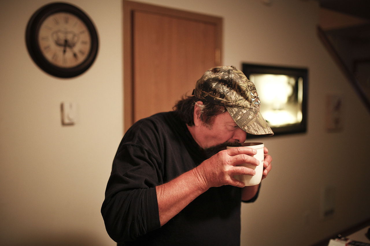 Gene Martin sips coffee before leaving for an Alcoholics Anonymous meeting.