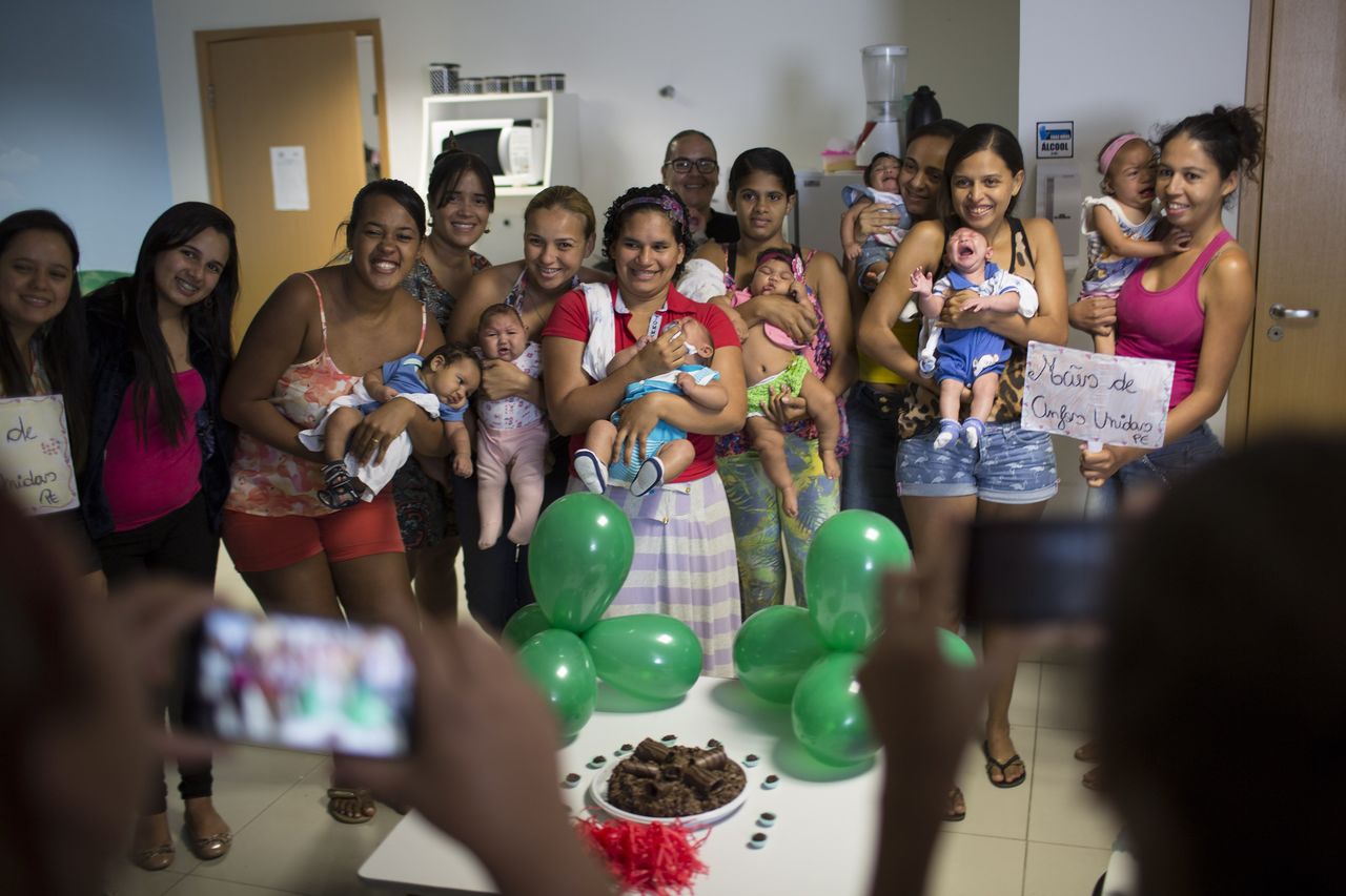 Mothers and their infants, all born with microcehaly, gather for a group photo during the two month birthday celebration of Juan Pedro, second baby from right, at the Altino Ventura Foundation, a treatment center that provides free health care, in Recife, Pernambuco state, Brazil, on Thursday.