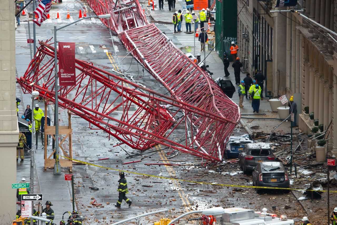 The huge construction crane was being lowered to safety in a snow squall when it plummeted onto the street in the Tribeca neighborhood of lower Manhattan.