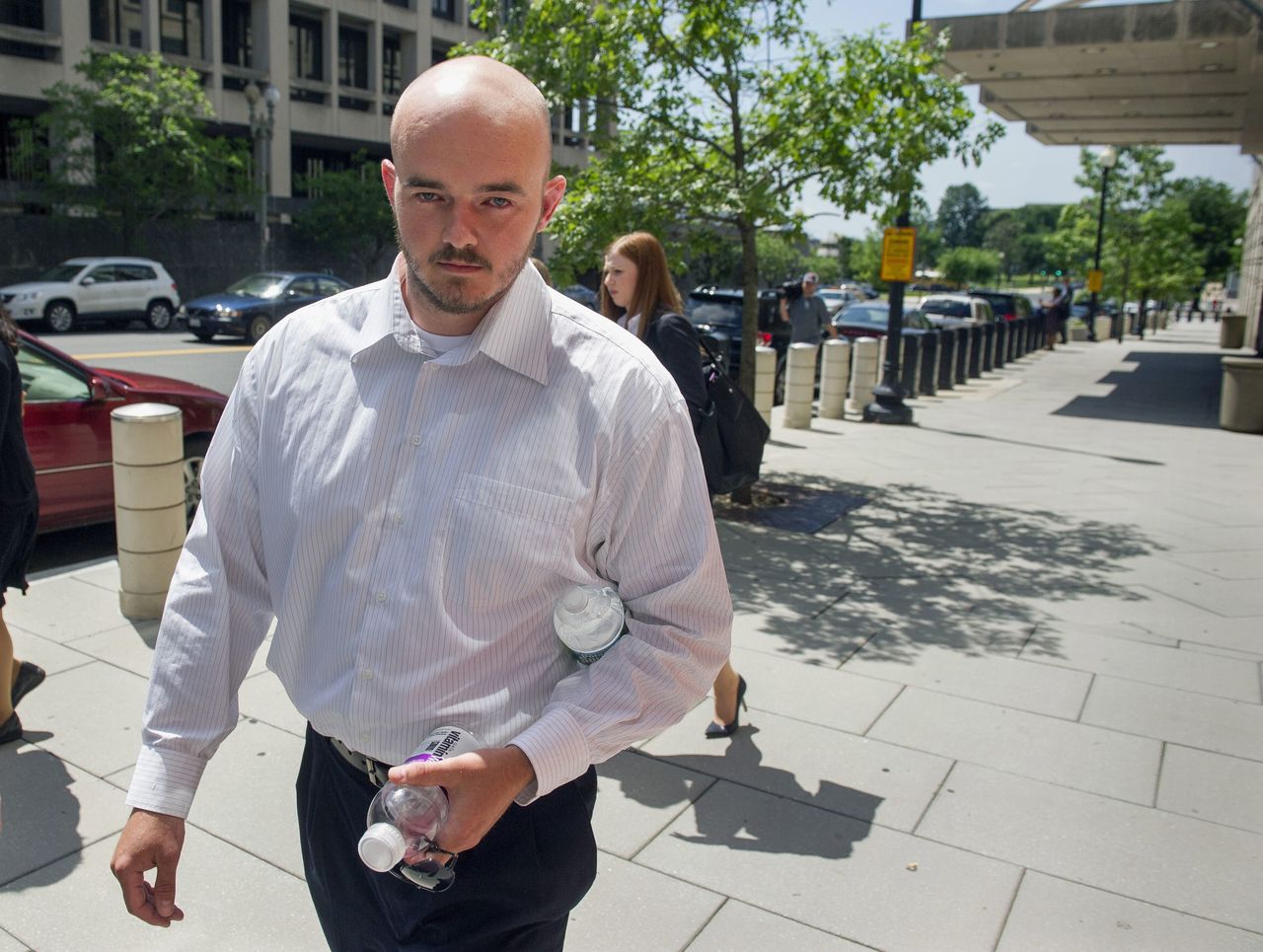 In this June 11, 2014, photo, former Blackwater Worldwide guard Nicholas Slatten leaves federal court in Washington. Slatten, found guilty for his role in a deadly Baghdad shooting has appealed his murder conviction. Slatten argued in an appeal filed Monday that the Justice Department’s prosecution of him was “vindictive” and that prosecutors were “determined to win at all costs.”