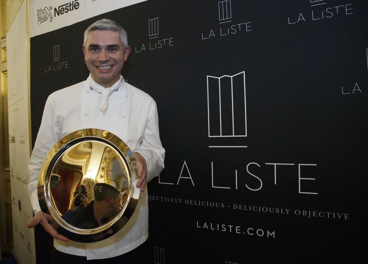 In this Dec.17, 2015, photo, French Swiss Chef Benoit Violier of the restaurant Hotel de Ville in Crissier, Switzerland, poses with his trophy for the Best Restaurant of the World during the award ceremony of “La Liste” (The List) at the French Foreign Ministry in Paris. Swiss police said Monday that the 3-star chef has been found dead of an apparent self-inflicted gunshot. He was 44.