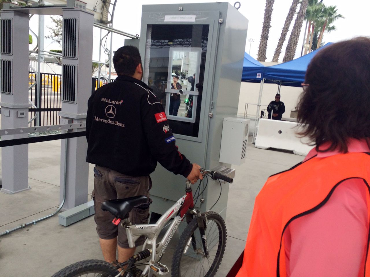 Ramon Rangel stands at a machine that captures images of his iris and facial features to verify his documents while leaving San Diego on his way to Mexico on Thursday.