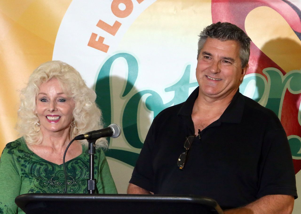 Maureen Smith and David Kaltschmidt answer questions about their winning ticket, which was one of three from the Jan. 13 world record Powerball jackpot, during a news conference Wednesday in Tallahassee, Florida.