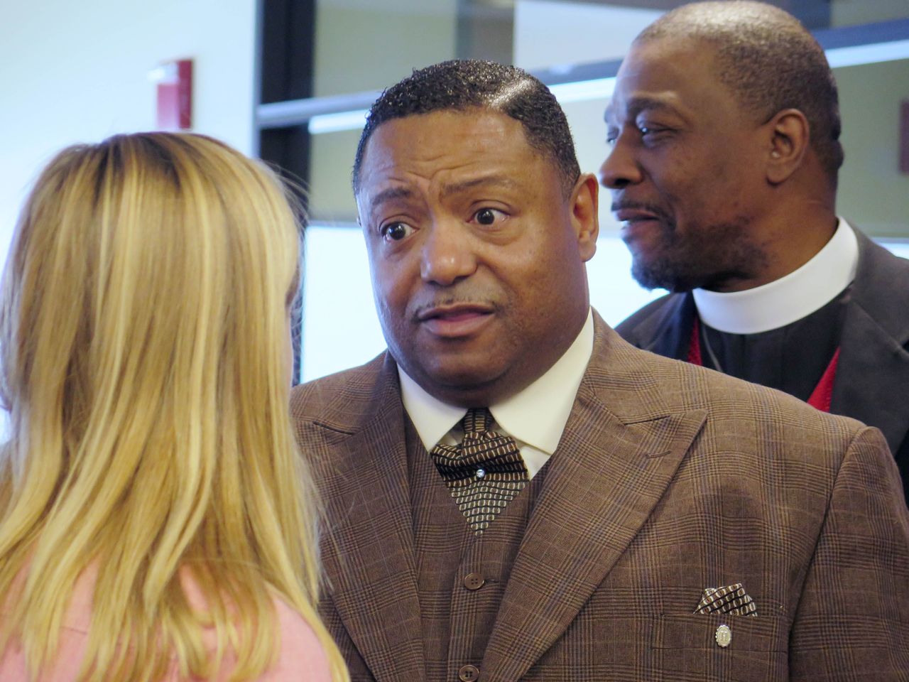 Rev. Marvin Hunter, the great uncle of Laquan McDonald, speaks to a reporter after a news conference at the Northwestern University School of Law in Chicago on Tuesday. A coalition of civil rights attorneys and others filed a court petition Tuesday seeking to force Cook County State’s Attorney Anita Alvarez to hand over the prosecution and any further investigation involving the fatal police shooting of McDonald to a special prosecutor.