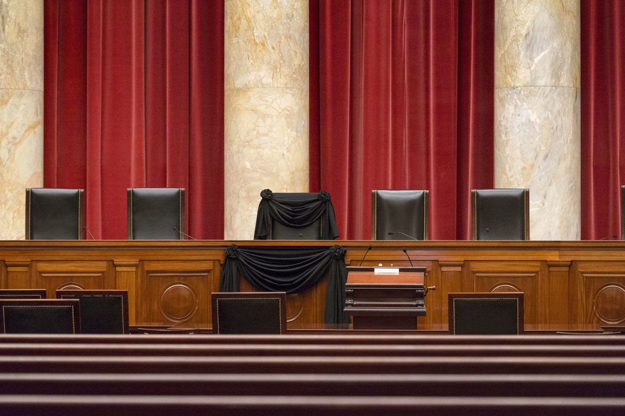 Supreme Court Justice Antonin Scalia’s courtroom chair is seen Tuesday draped in black to mark his death as part of a tradition that dates to the 19th century at the Supreme Court in Washington. Scalia died Saturday at age 79. He joined the court in 1986 and was its longest-serving justice.