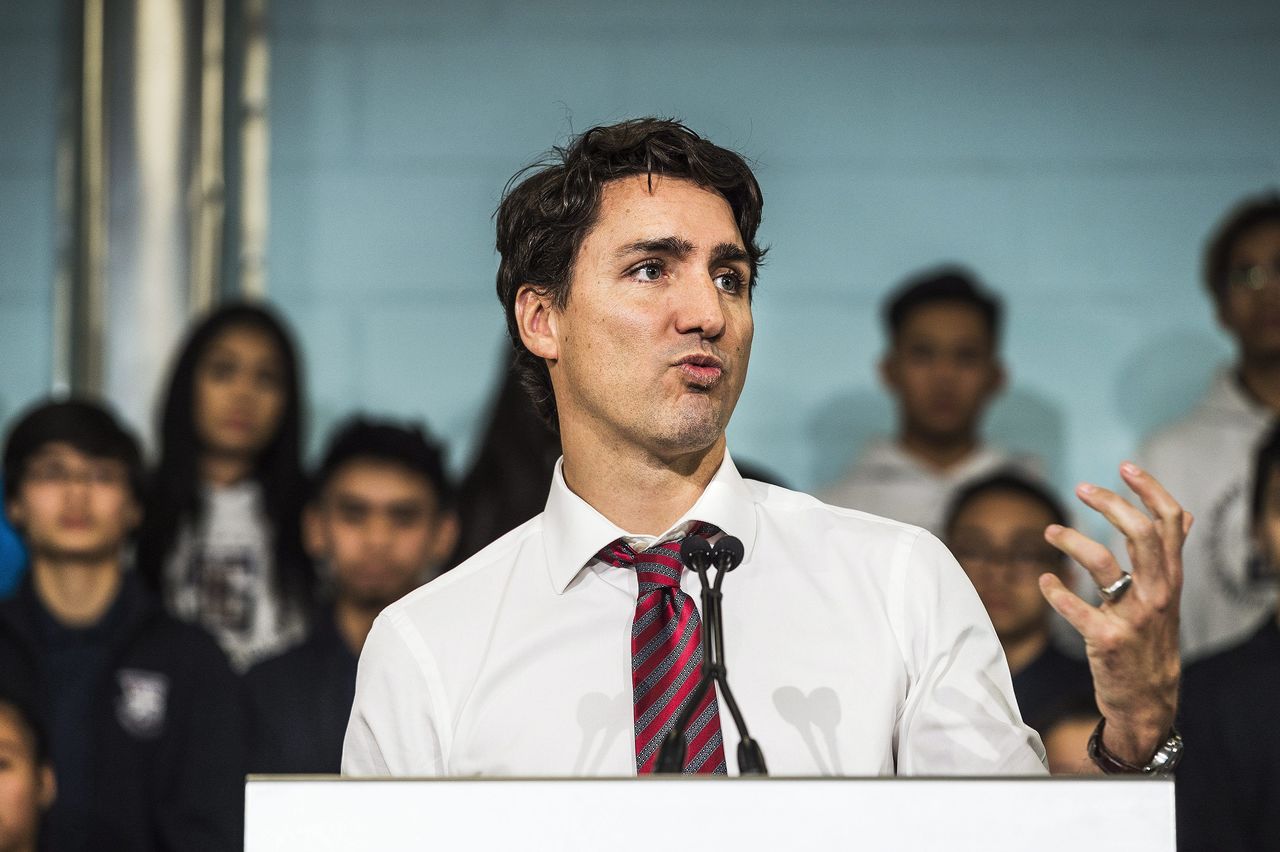 Canadian Prime Minister Justin Trudeau speaks to media about his first 100 days in office and announces the expansion of the Canada Summer Jobs Program at the Dovercourt Boys and Girls Club in Toronto on Friday, Feb. 12, 2016. (Aaron Vincent Elkaim/The Canadian Press via AP)