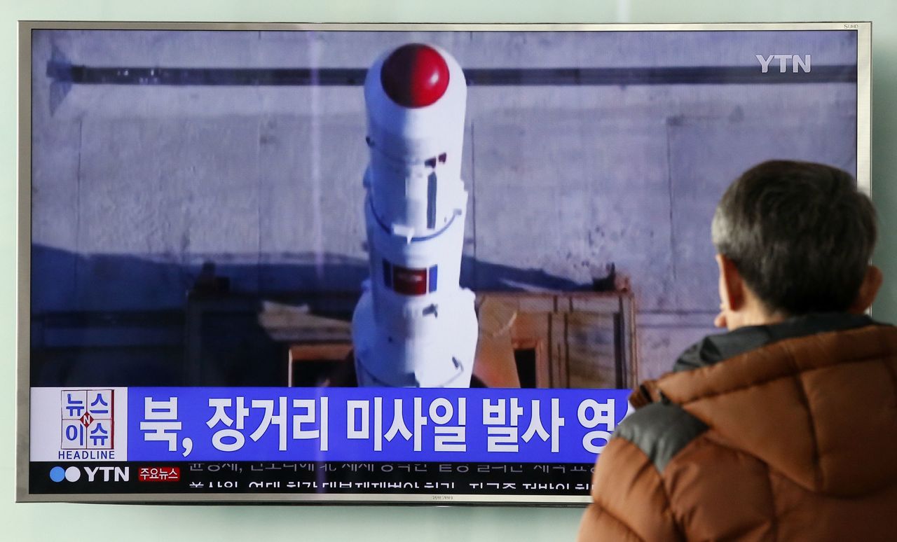A man in Seoul, South Korea, watches a TV news program Thursday about a recent North Korean rocket launch.