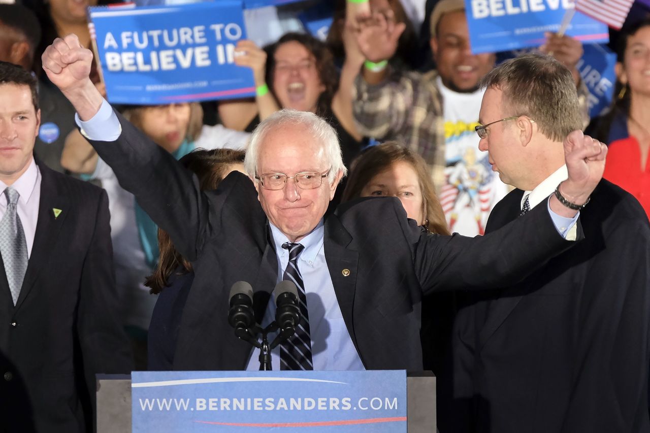 Democratic presidential candidate Bernie Sanders reacts to a cheering crowd in Manchester.