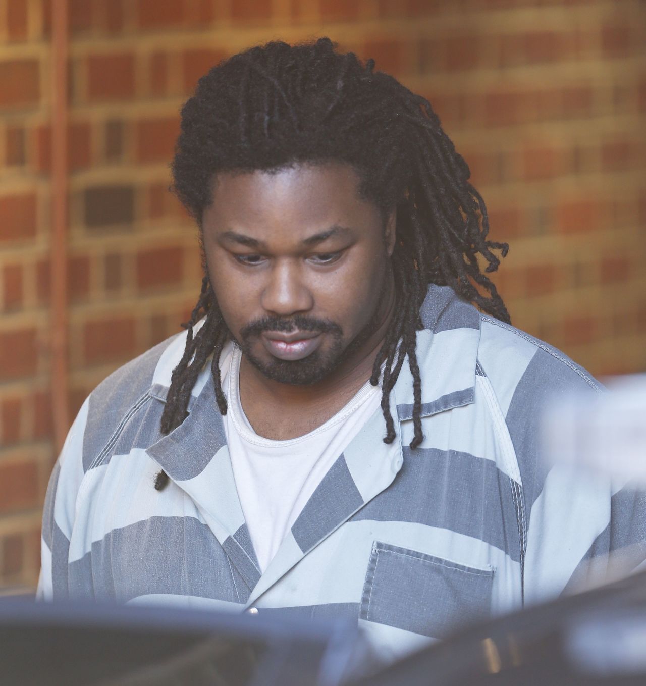 This Dec. 7, 2015, photo shows Jesse Matthew Jr. as he is led out of the Albemarle Circuit Court building. The former hospital worker is expected to plead guilty in the high-profile slayings of two college students in Virginia, a prosecutor said Monday.