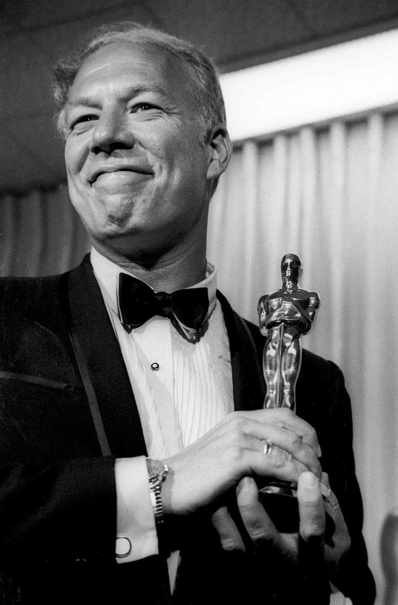In this April 10, 1968, photo, George Kennedy poses with his Oscar in Santa Monica, California, after winning best supporting actor for “Cool Hand Luke.” Kennedy died Sunday of natural causes in Boise, Idaho, where he moved with his late wife in 2002. He was 91.