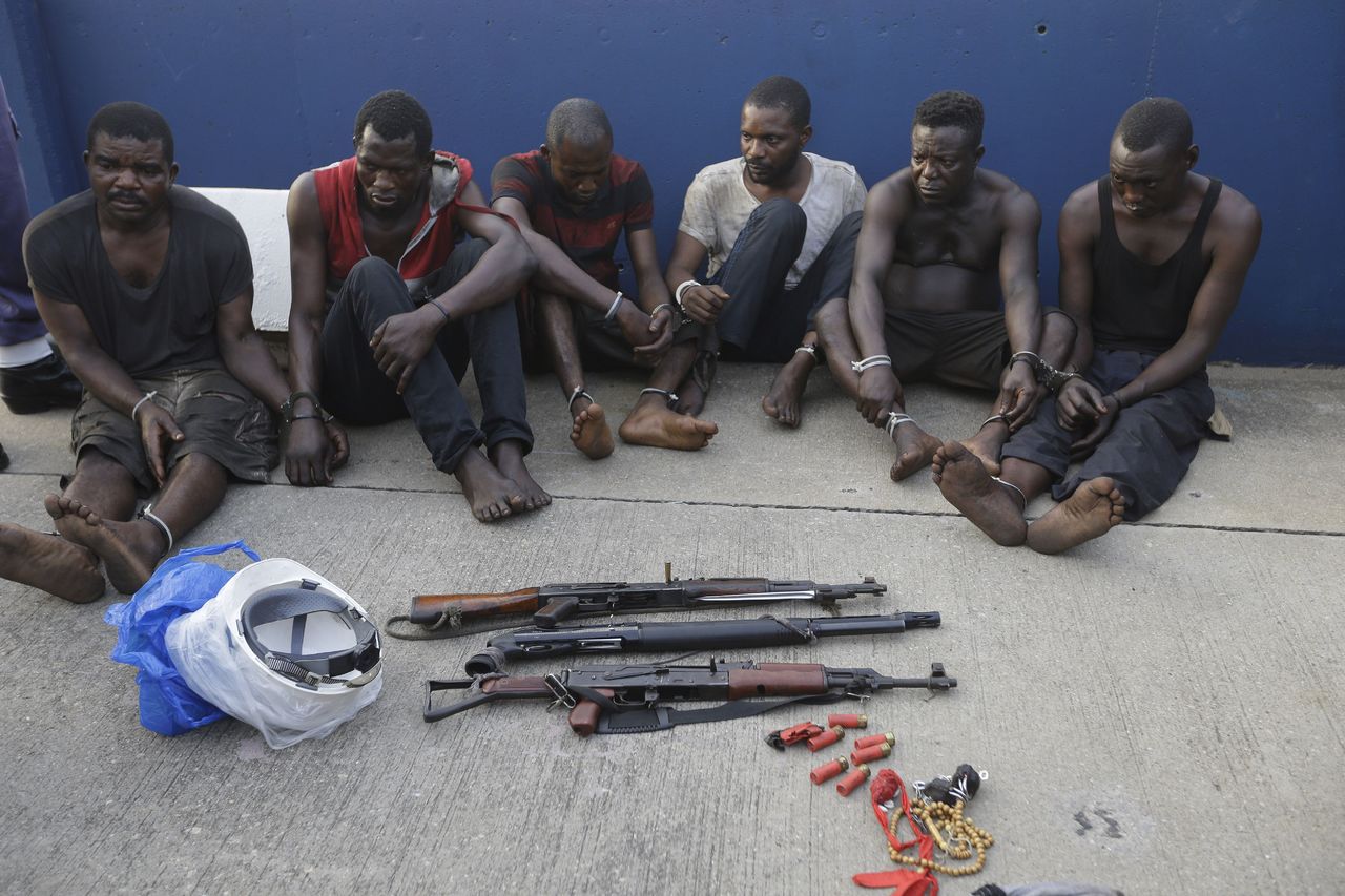 The arrested piracy suspects are shown to the media in Lagos on Monday.