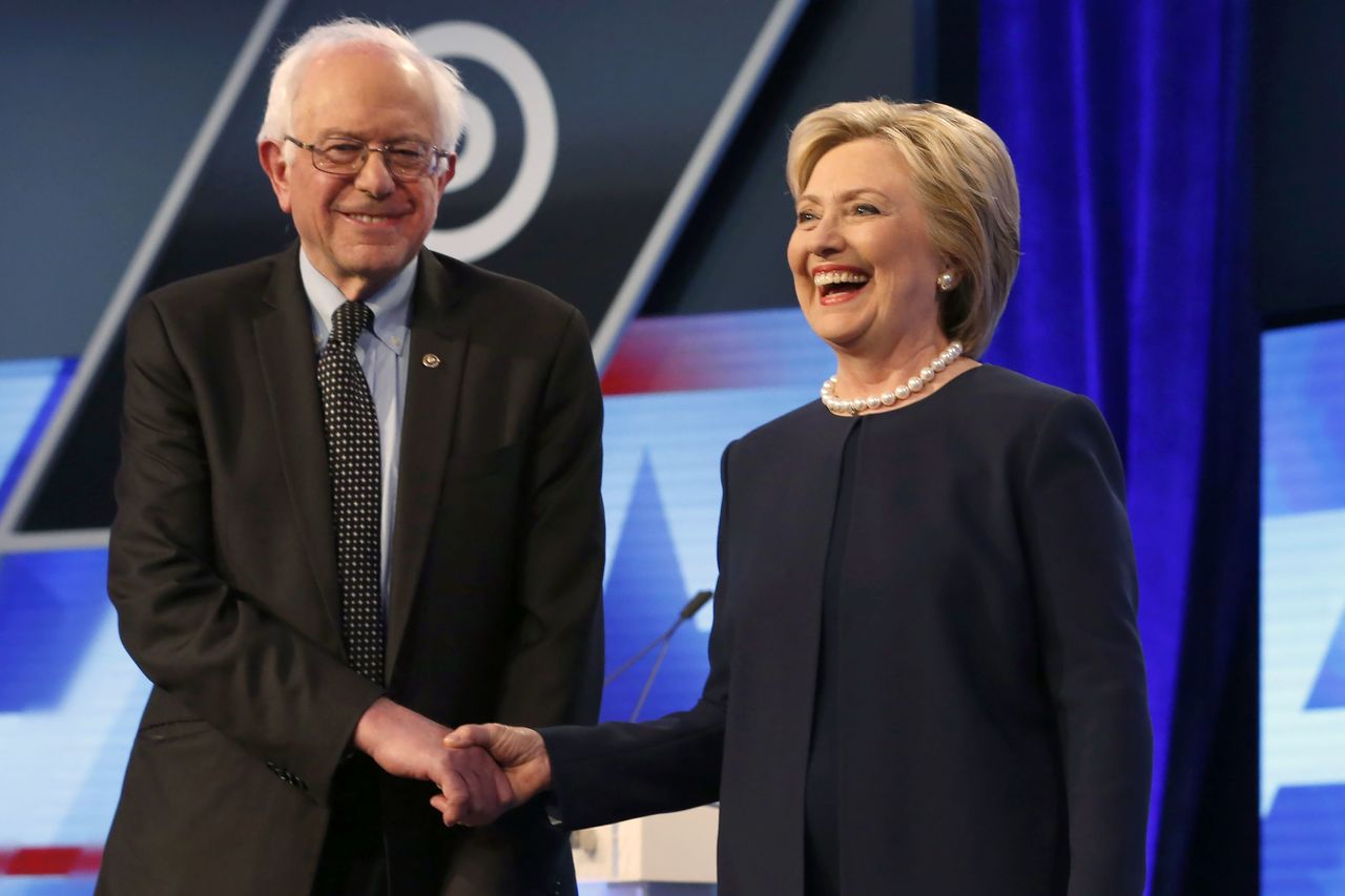 Democratic presidential candidates Hillary Clinton and Sen. Bernie Sanders shake hands before the start of their debate at Miami-Dade College in Florida on Wednesday.