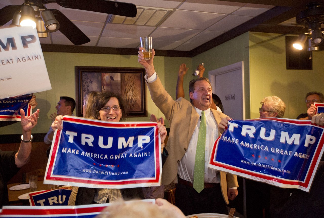 Supporters celebrate as GOP candidate Donald Trump is announced as the winner in Virginia at Pembroke Pizza in Virginia Beach, Virginia, on Tuesday.
