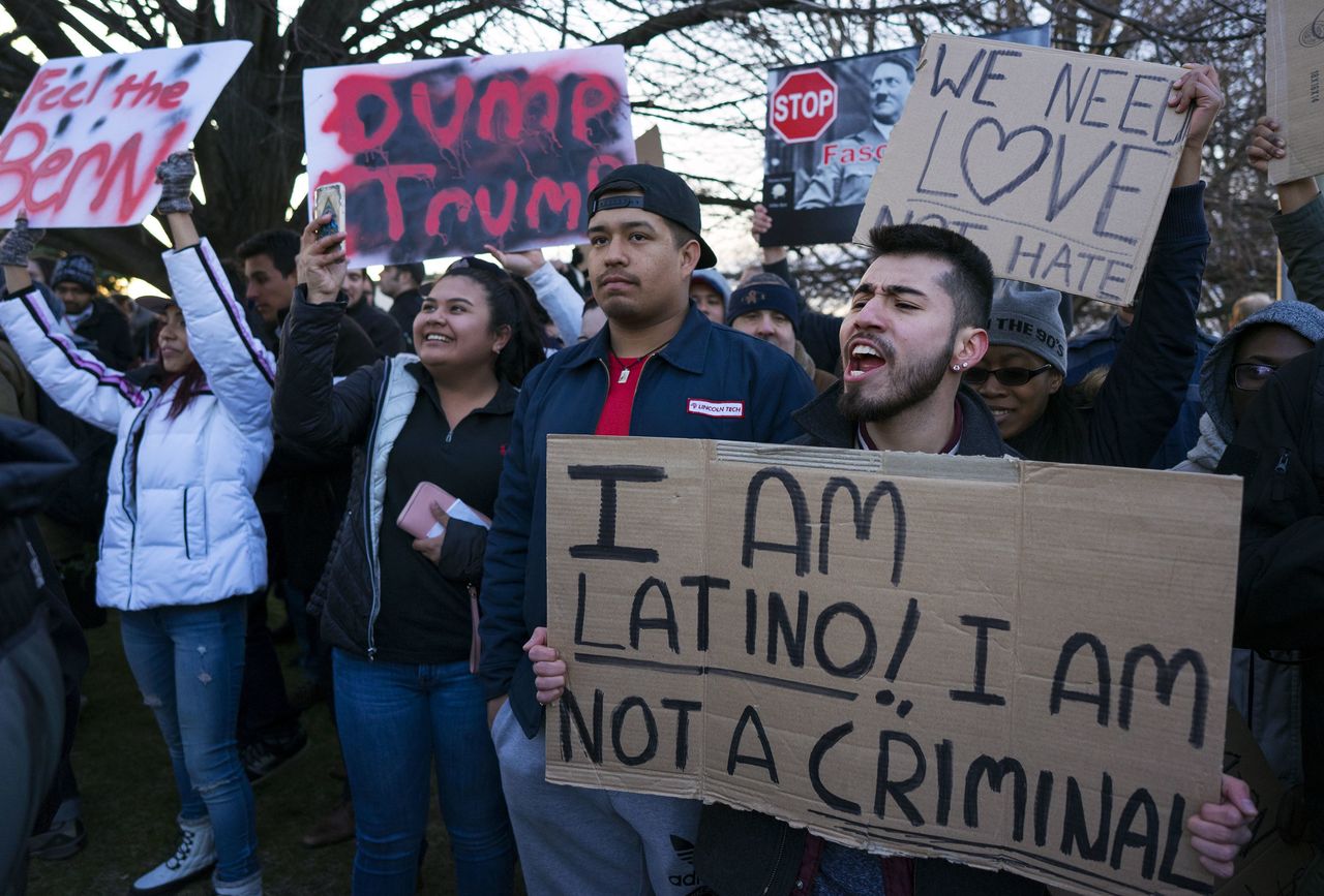 People protesting against Donald Trump shout toward Trump supporters near the site of a campaign appearance by the Republican presidential candidate in Bethpage, New York, on Wednesday.