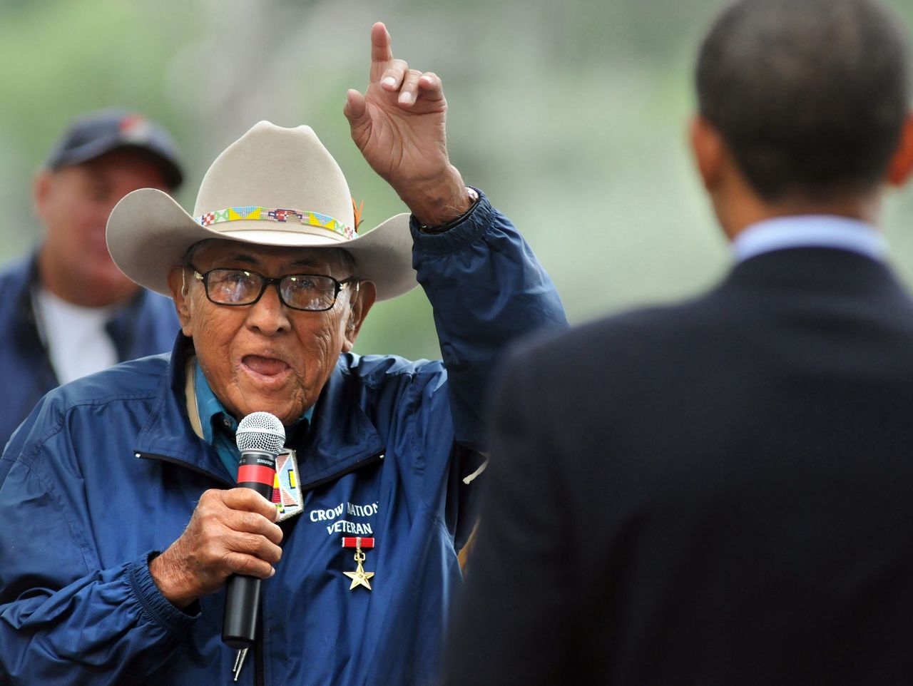 Native American historian Joe Medicine Crow speaks to then-presidential-candidate Barack Obama in 2008.