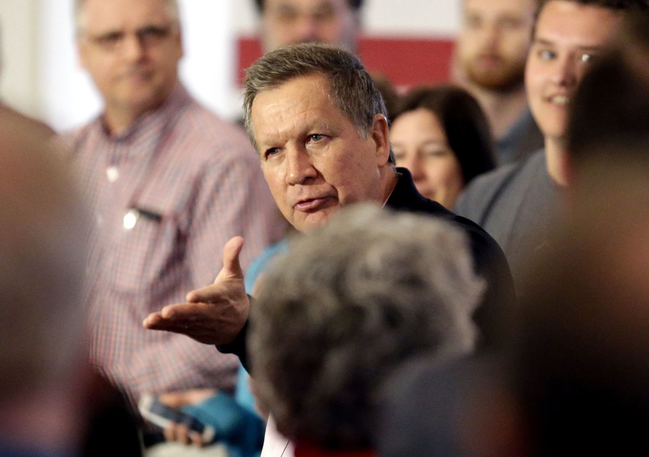 Republican presidential candidate John Kasich talks to supporters Saturday in Burlington, Wisconsin.
