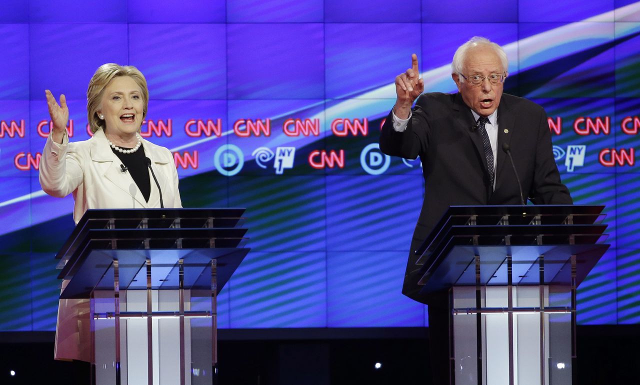Democratic presidential candidates Hillary Clinton and Bernie Sanders speak during the CNN Democratic Presidential Primary Debate at the Brooklyn Navy Yard on Thursday in New York.