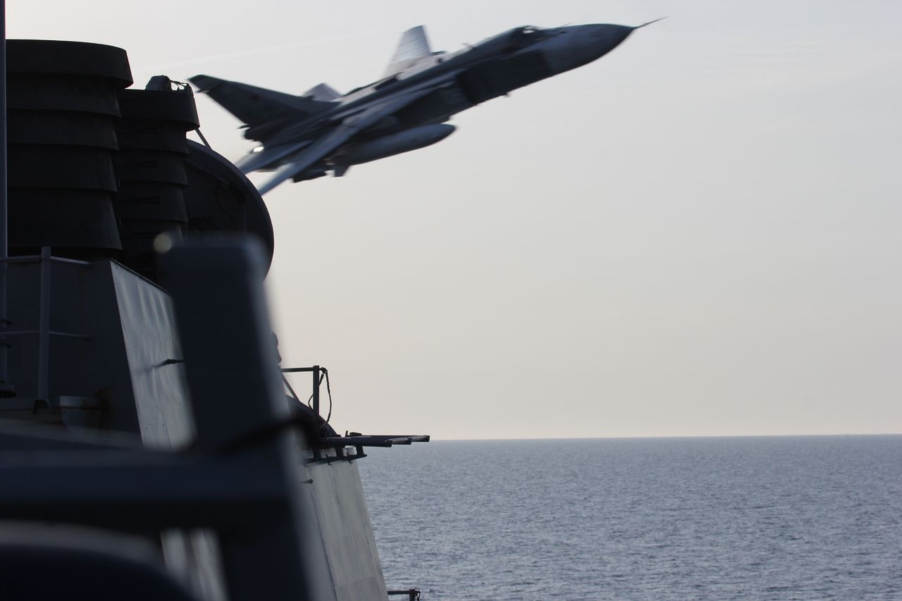 A Russian SU-24 jet makes a close-range, low altitude pass near the USS Donald Cook on Tuesday in the Baltic Sea.