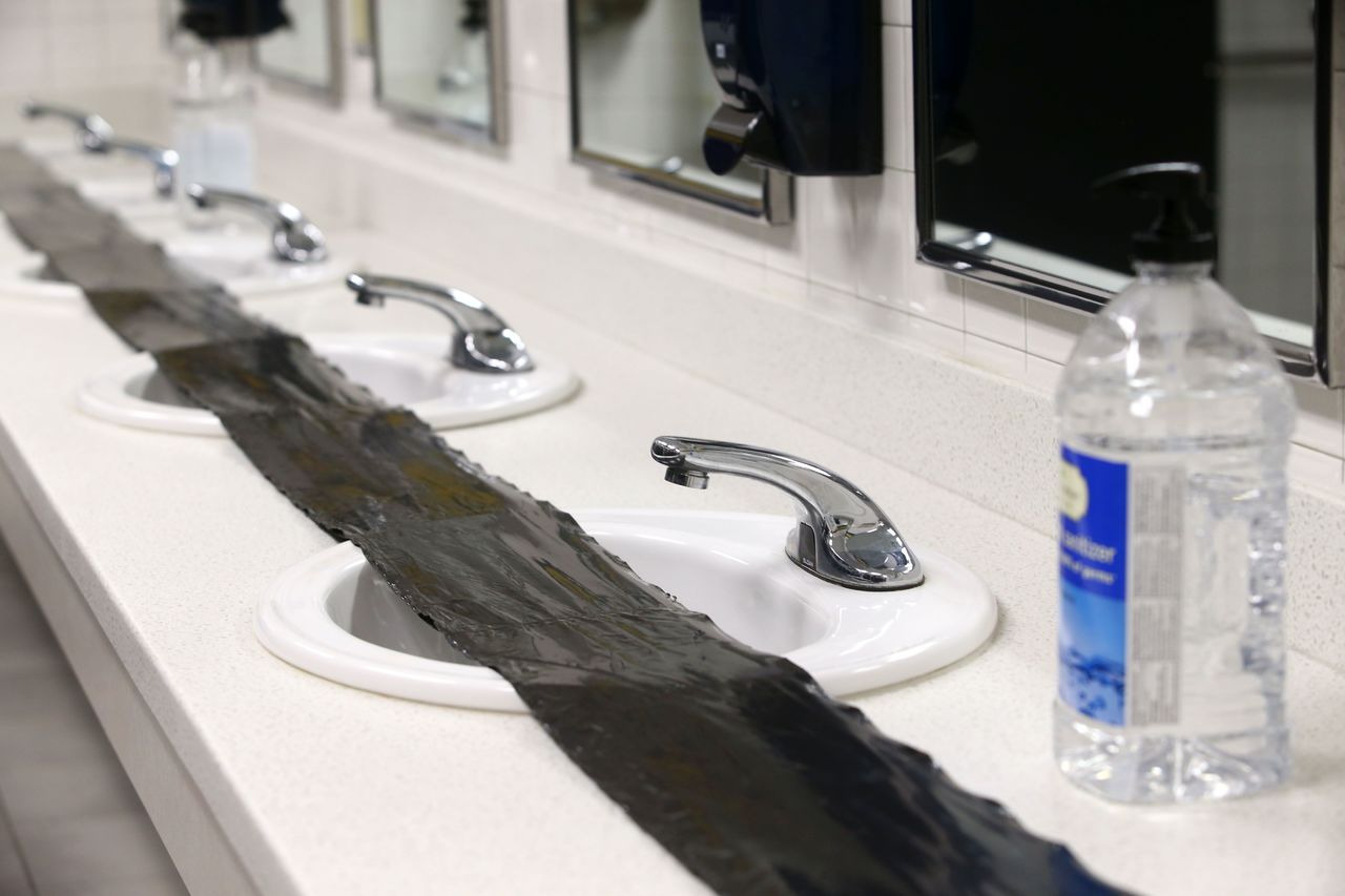 The sinks at Eastern High School in Greentown, Indiana, were covered with trash bags in February to stop students, staff and visitors from using the water because of concerns about elevated lead levels.