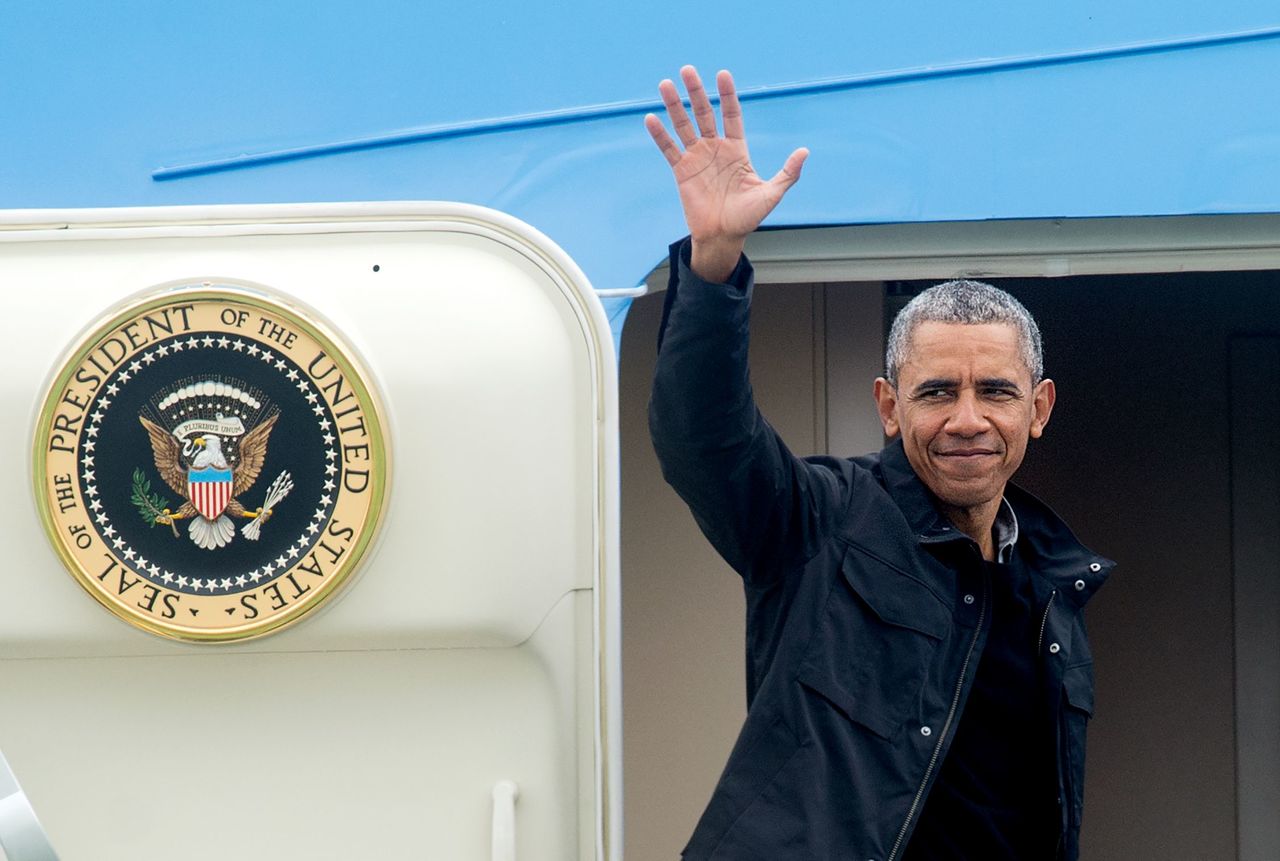 President Barack Obama waves while boarding Air Force One at San Francisco International Airport on Saturday.