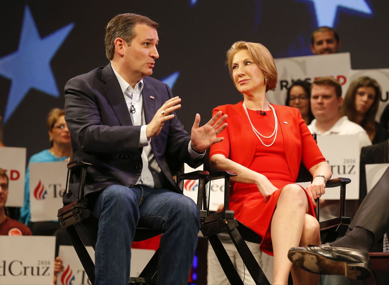 In this photo taken March 11, 2016, Republican presidential candidate Sen. Ted Cruz speaks to Carly Fiorina in Orlando, Florida.