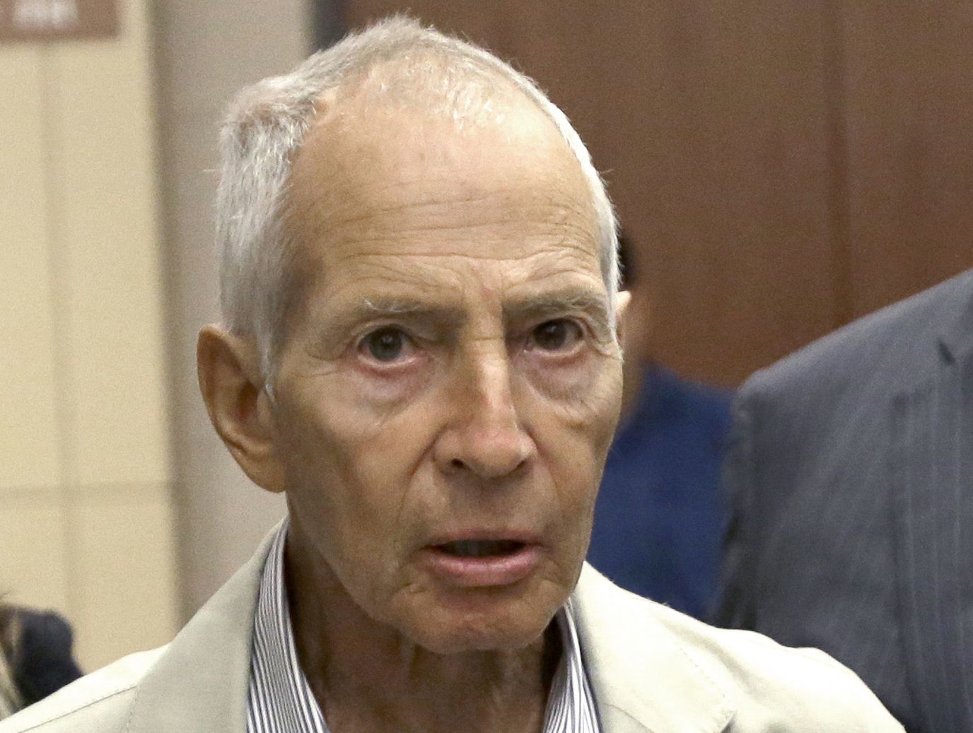 In this Aug. 15, 2014, photo, New York City real estate heir Robert Durst leaves a Houston courtroom. New Orleans Federal Judge Kurt Engelhardt on Wednesday approved a plea agreement for Durst to serve 7 years, 1 month in prison on a weapons charge. Durst still faces a separate murder charge in California.