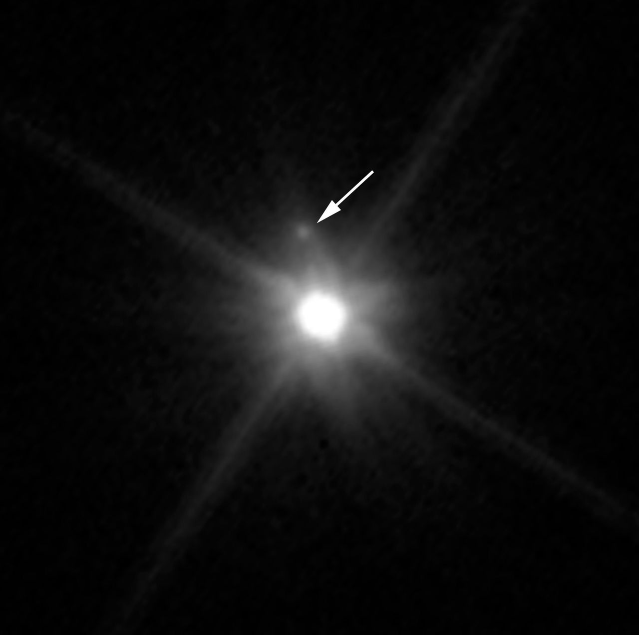 An undated photo made by NASA’s Hubble Space Telescope shows a small, dark moon orbiting Makemake, the second brightest icy dwarf planet, after Pluto, in the Kuiper Belt. This is the first discovery of a companion object to Makemake. The moon, provisionally designated S/2015 (136472) 1 and nicknamed MK 2, is more than 1,300 times fainter than Makemake.