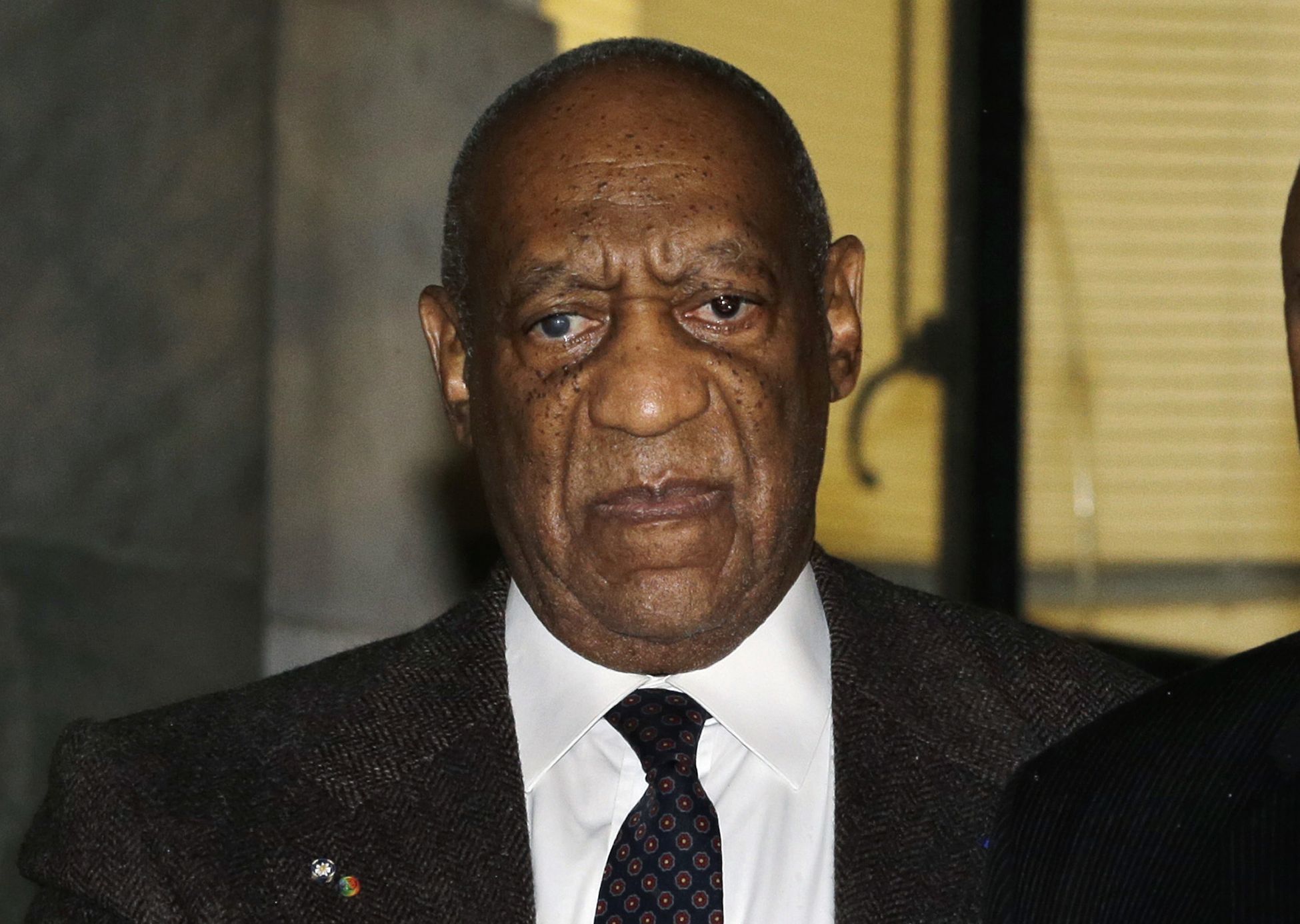 Actor and comedian Bill Cosby is assisted as he leaves after a court appearance Feb. 3 in Norristown, Pennyslvania. A Pennsylvania appeals court on Monday has rejected Cosby’s attempt to halt his criminal case because of what he called a decade-old deal not to prosecute him. The 78-year-old Cosby is facing trial over a 2004 encounter at his home with a then-Temple University employee.