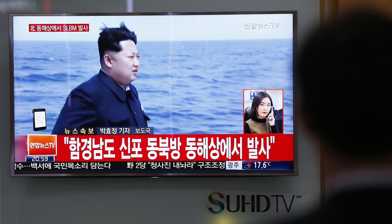 A man watches a TV news program showing North Korean leader Kim Jong Un at the Seoul Train Station in Seoul, South Korea, on Saturday.