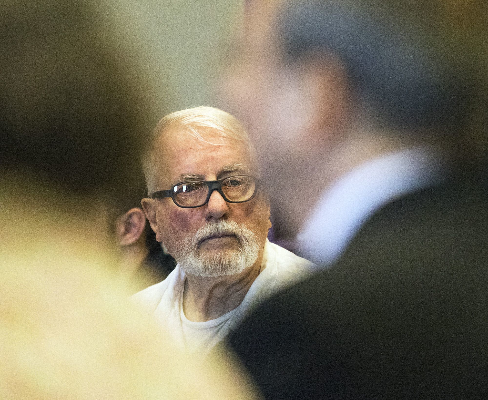 Jack McCullough looks to the back of the DeKalb County courtroom between Maria Ridulph’s sister Pat Quinn (left) and brother Charles Ridulph (right) during a hearing in the DeKalb County Courthouse on Fridayin Sycamore, Illinois.