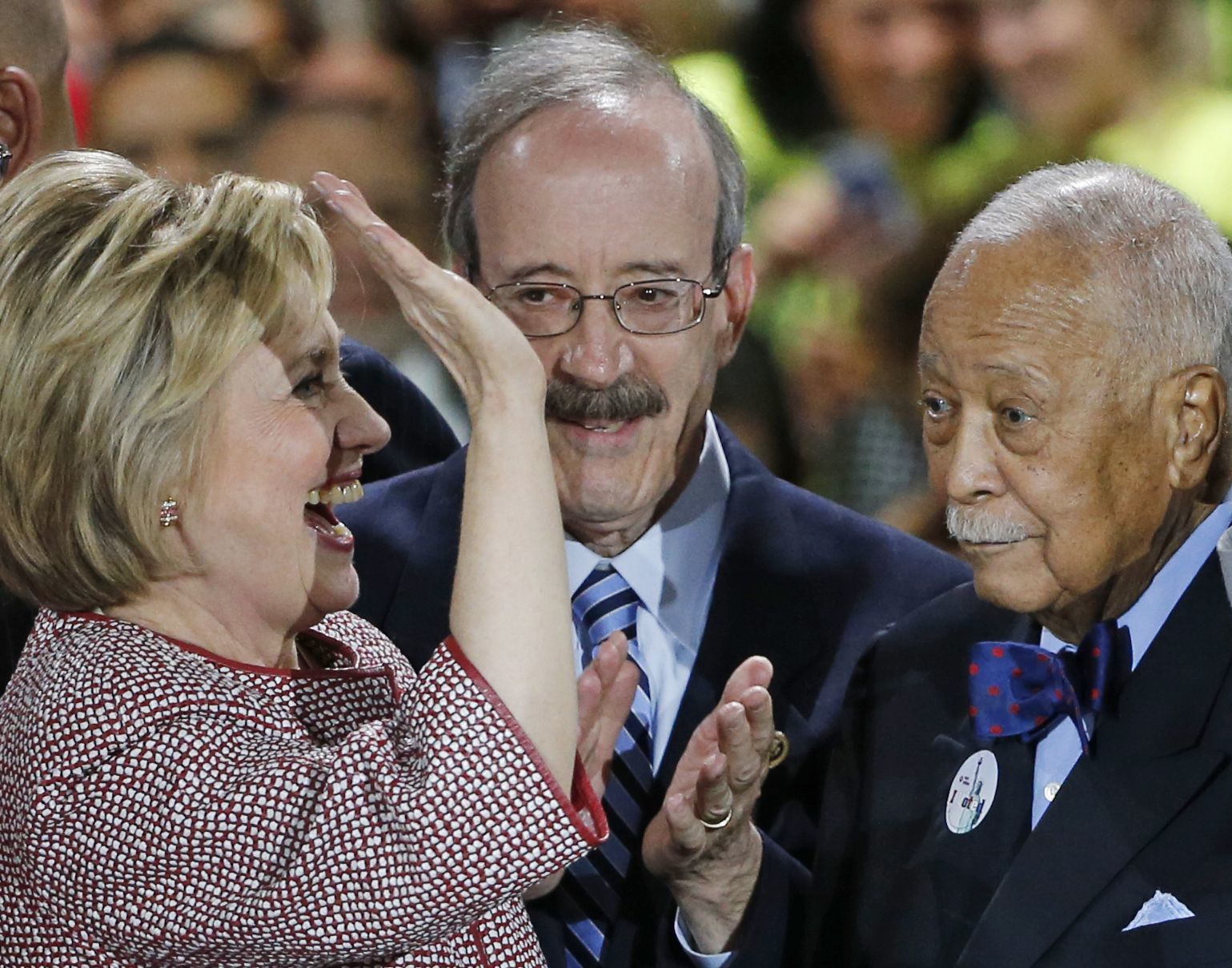 Democratic presidential candidate Hillary Clinton celebrates on stage with former New York Mayor David Dinkins at her New York primary campaign headquarters Wednesday in New York.