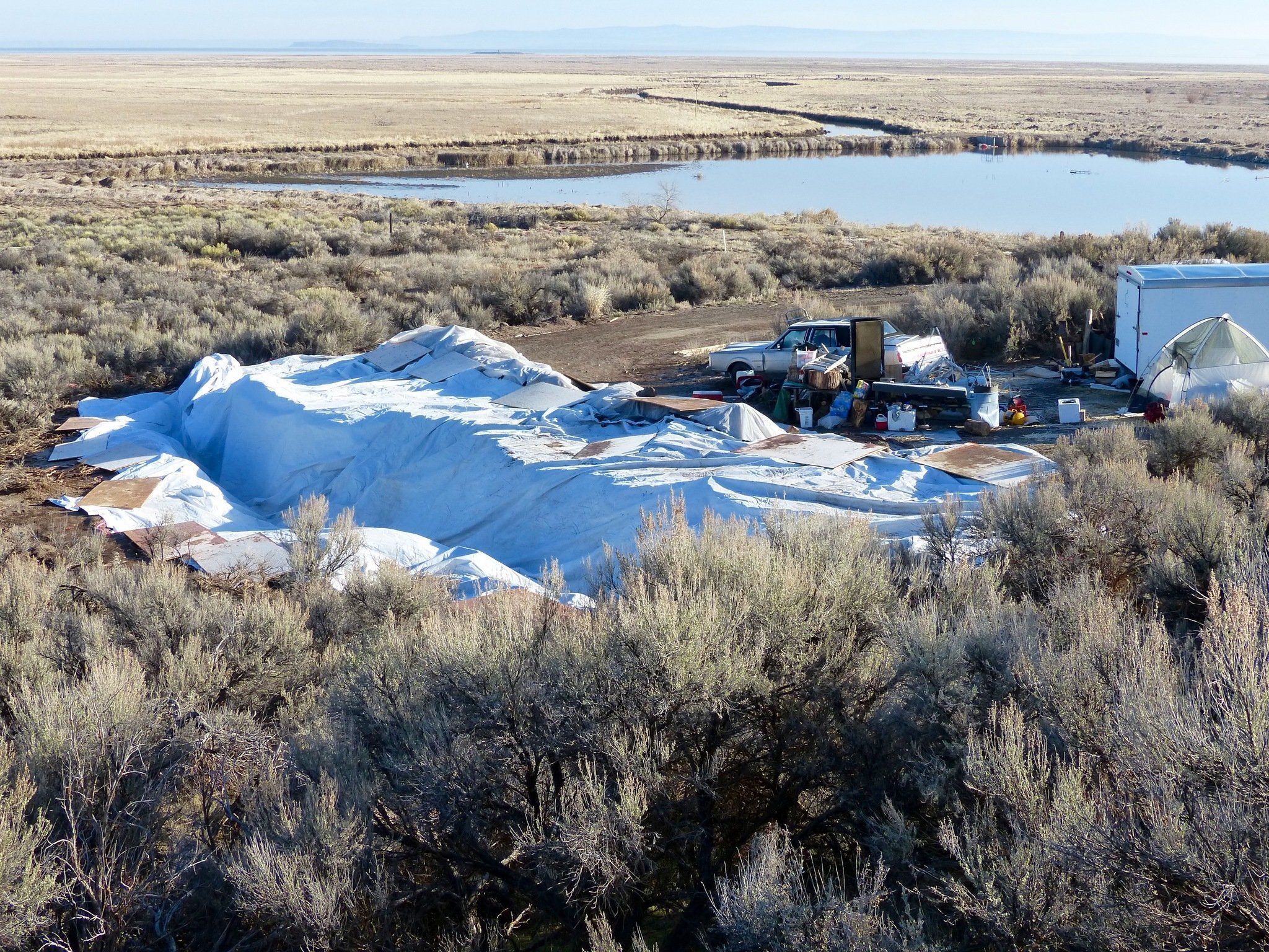 Vehicles, debris, and supplies remain Friday at what’s left of Camp Finicum, the crude encampment used by the last four occupiers of the 41-day takeover of the Malheur National Wildlife Refuge outside of Burns, Oregon. Armed officers from the U.S. Fish & Wildlife Service still block access to the wildlife refuge headquarters, but they’ll soon be gone as the agency takes steps to return the compound to normal.